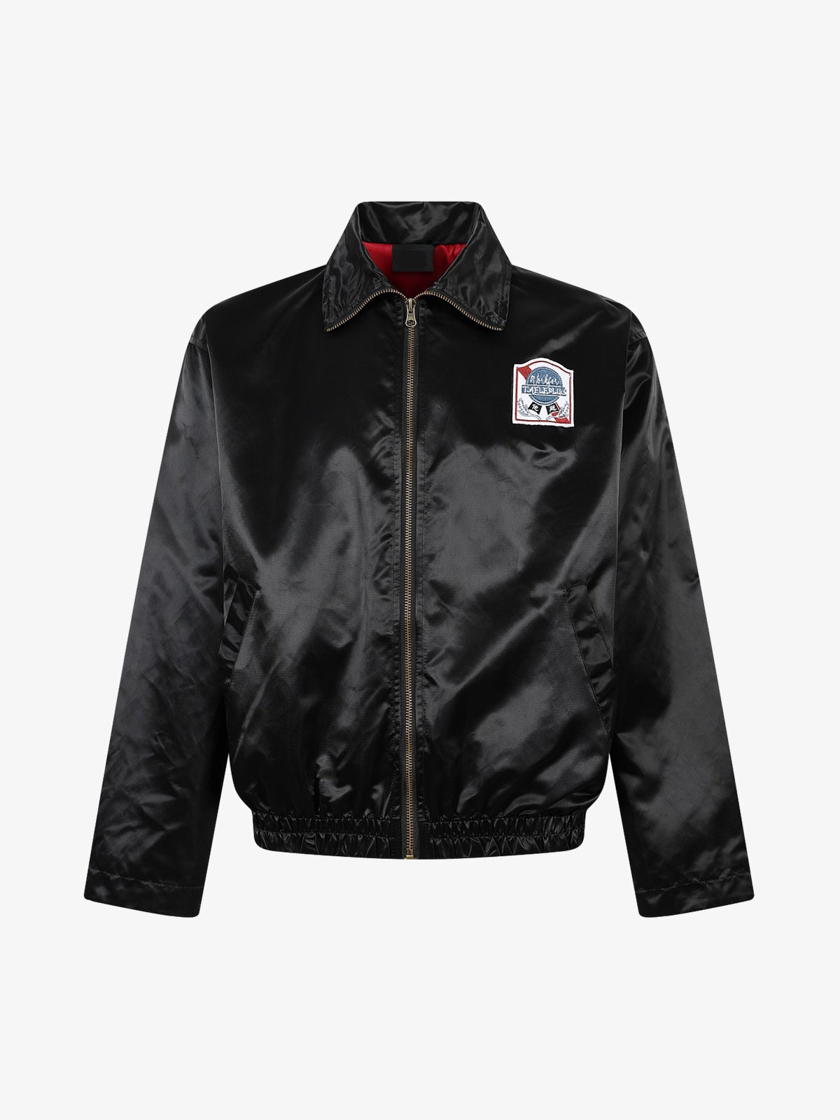 Detailed view of the embroidered lettering on the jacket