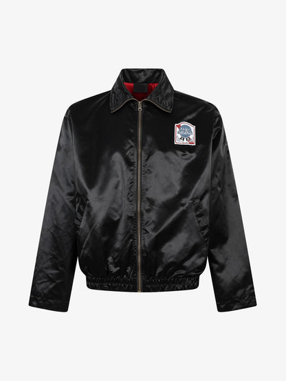 Detailed view of the embroidered lettering on the jacket