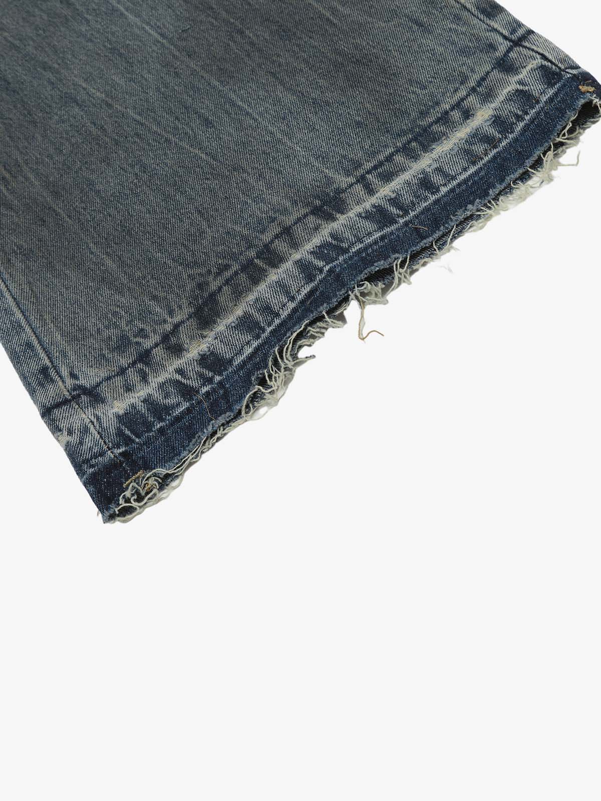 Full-length view of high-waisted ripped wide-leg jeans
