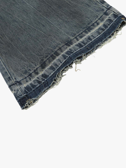 Full-length view of high-waisted ripped wide-leg jeans