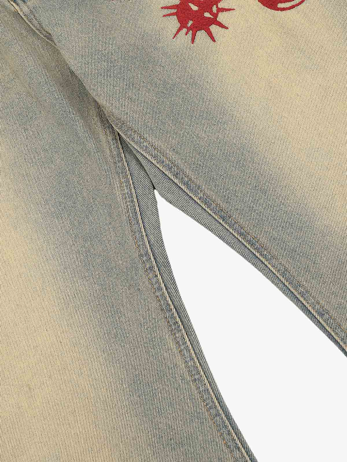 Back view of distressed wide-leg jeans in blue denim
