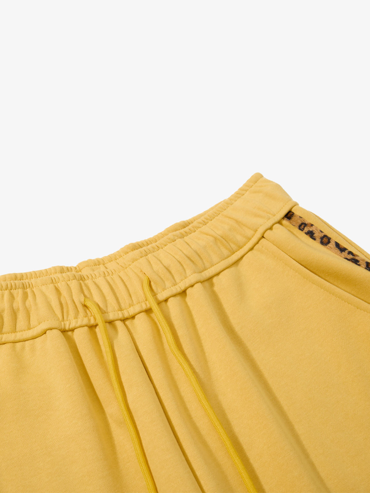 Side view of leopard print graphic wide-leg sweatpants