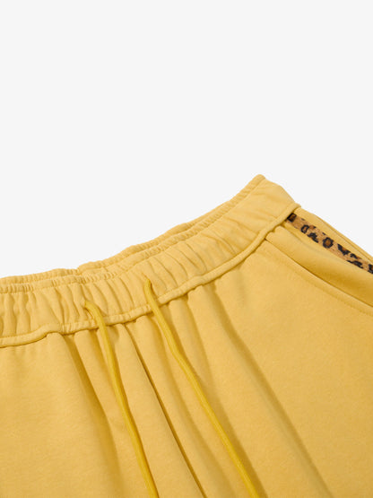 Side view of leopard print graphic wide-leg sweatpants