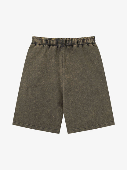 Back view of women's distressed cotton shorts with embellished detailing