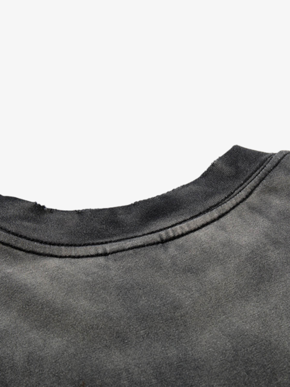 Close-up of hem and stitching on washed graphic cotton T-shirt
