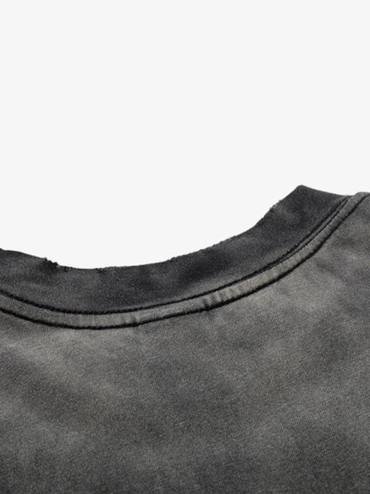 Close-up of hem and stitching on washed graphic cotton T-shirt