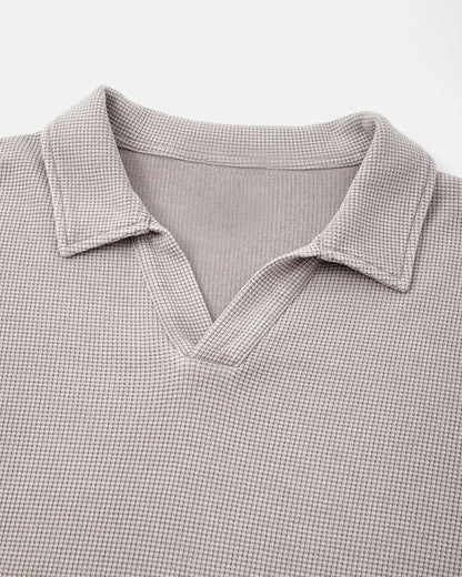 Detail of the collar and waffle texture on a washed polo shirt