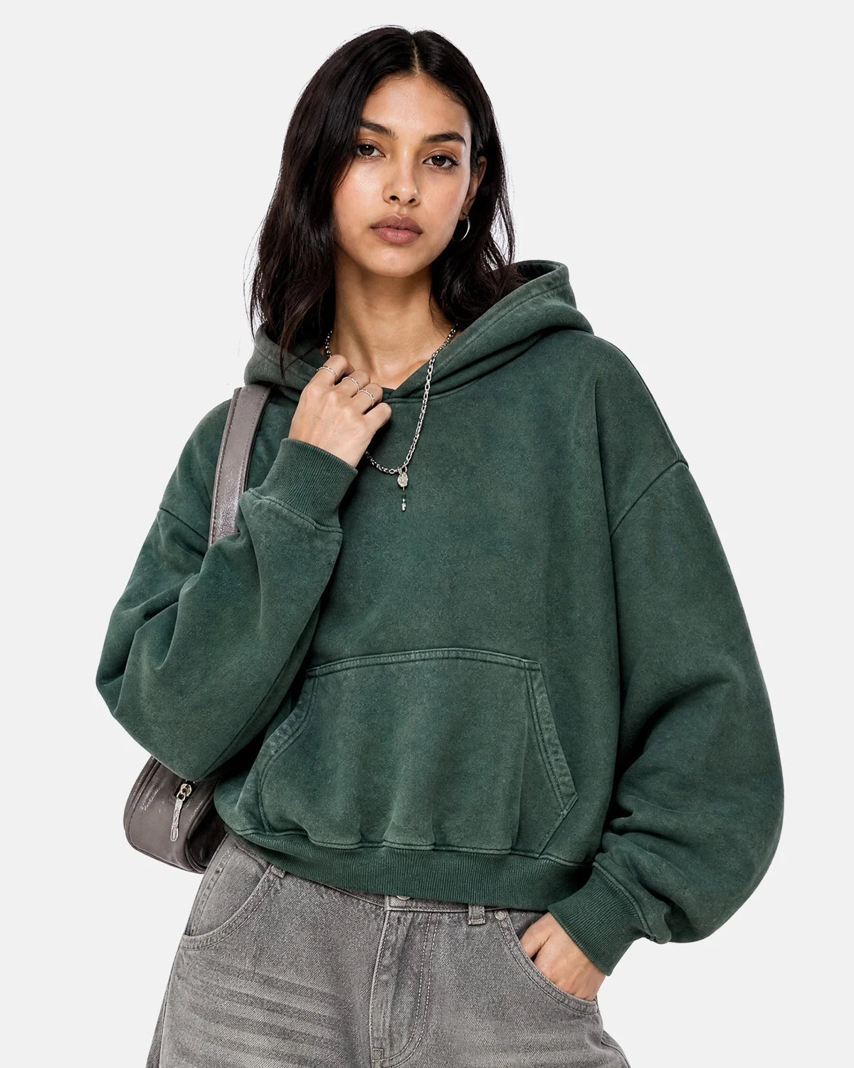 Relaxed streetwear hoodie showing its long sleeves