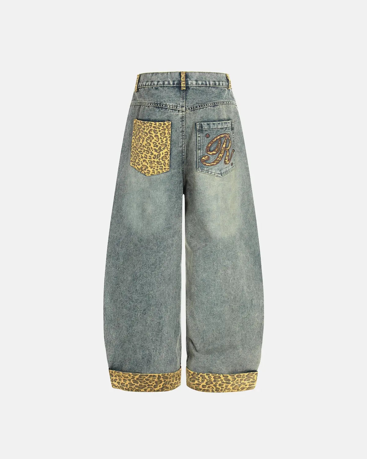 Back view of leopard patchwork jeans with embroidered accents