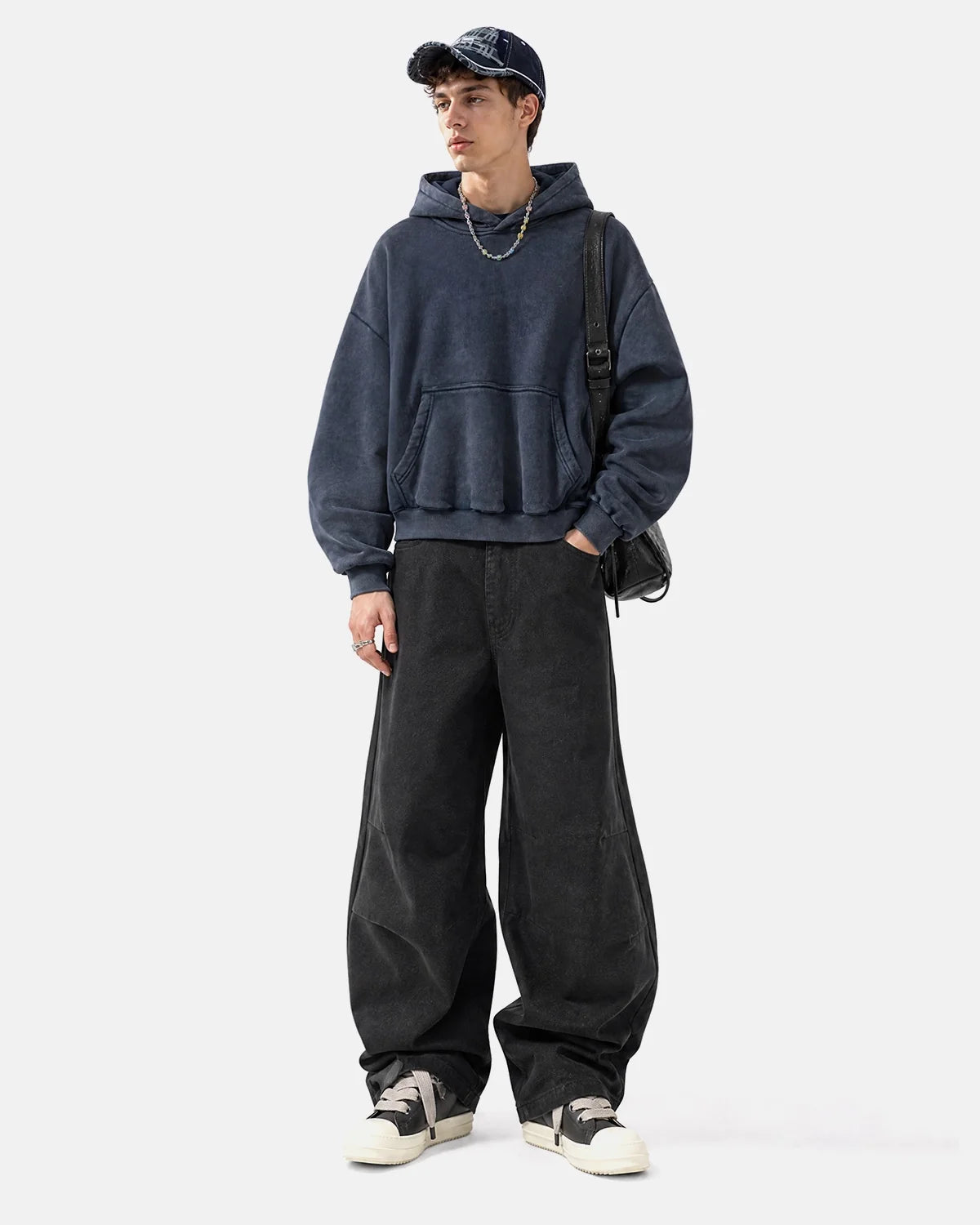 Side view of the boxy hoodie and dropped shoulders