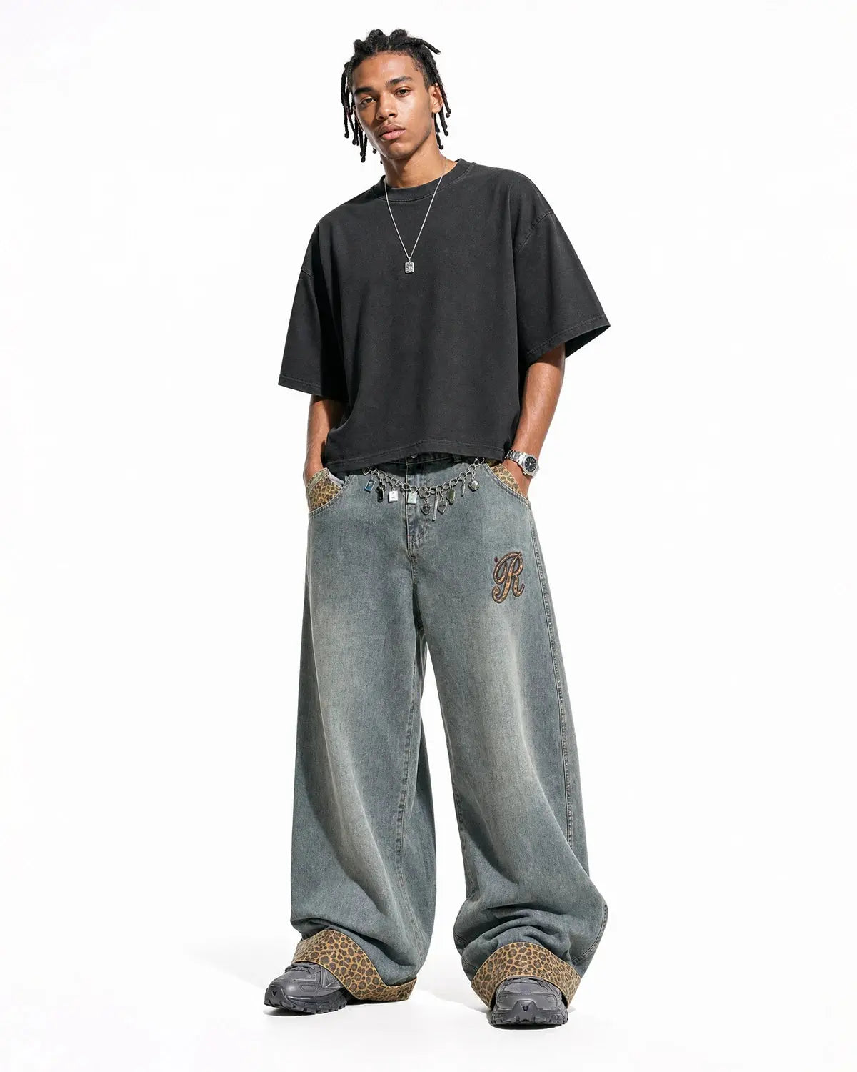 Full-length view of embroidered leopard patchwork jeans