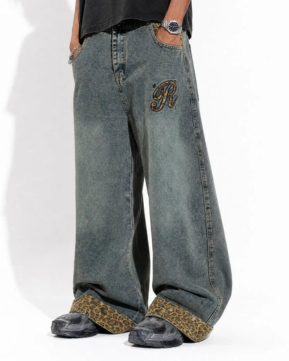 Close-up of embroidery on leopard patchwork denim jeans