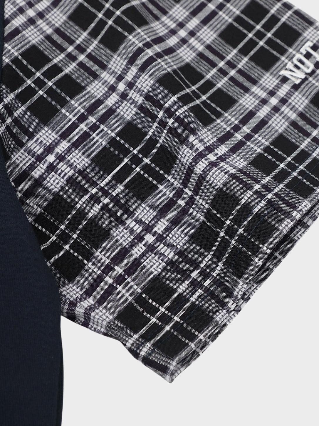 Plaid sleeve cotton polo shirt styled for a casual outfit