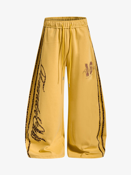 Leopard print graphic wide-leg sweatpants shown from the front