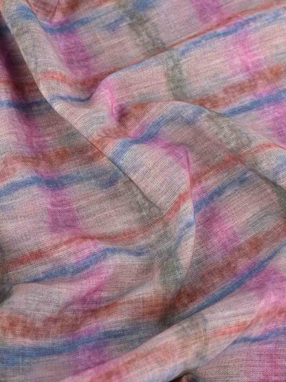 Close-up of the tie-dye fabric and lace-up detail on the cap