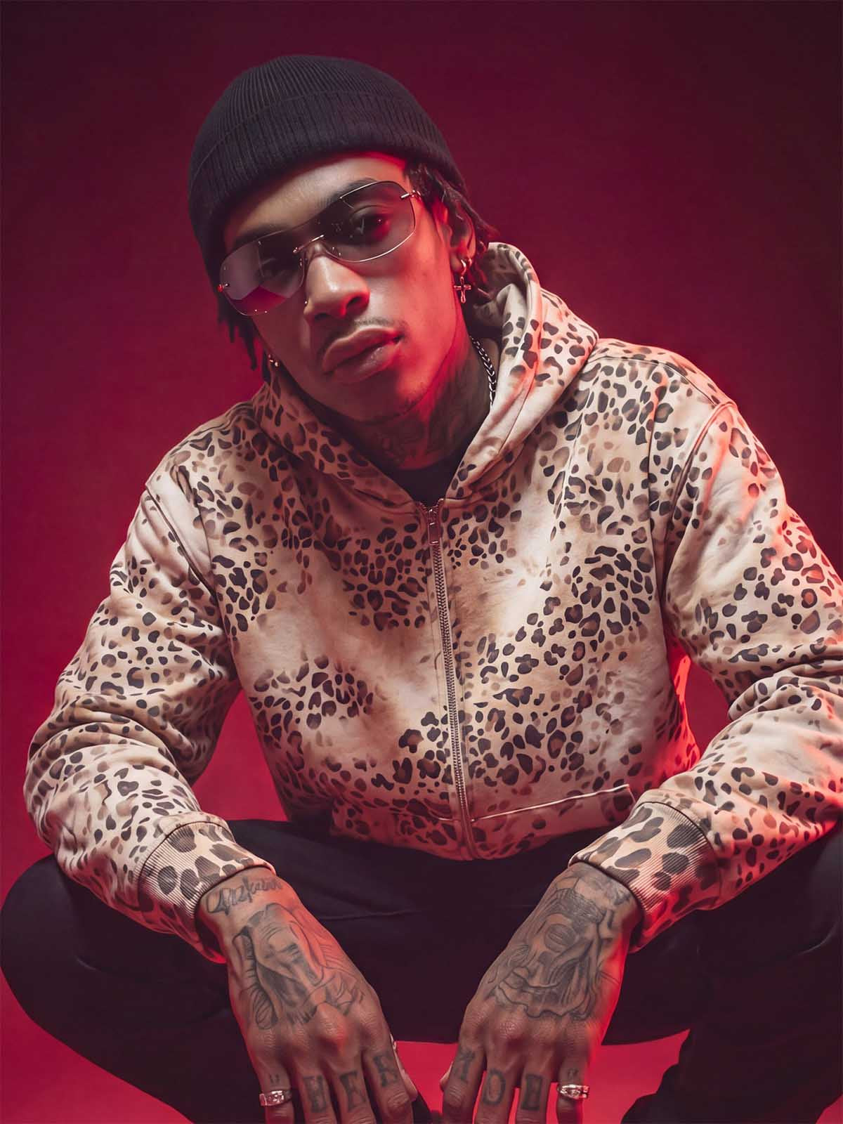 Front view of a distressed cropped leopard print hoodie