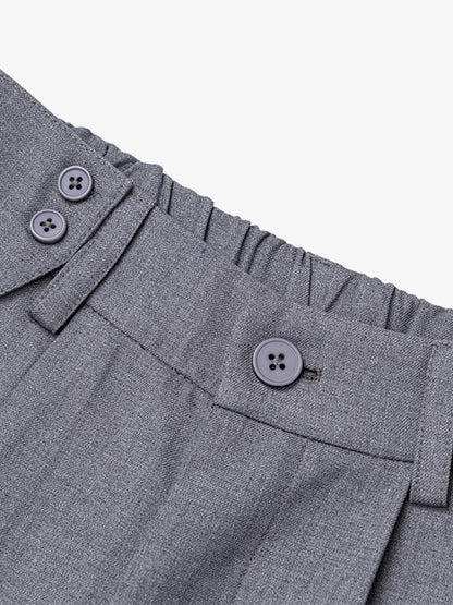 Grey pleated tailored shorts styled for a polished smart casual look