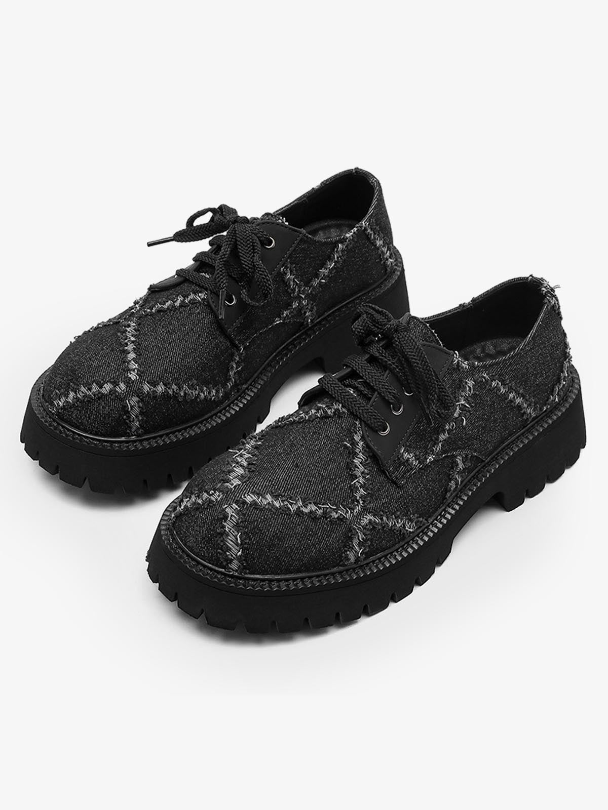 Angled view of black platform derby shoes for a bold streetwear look
