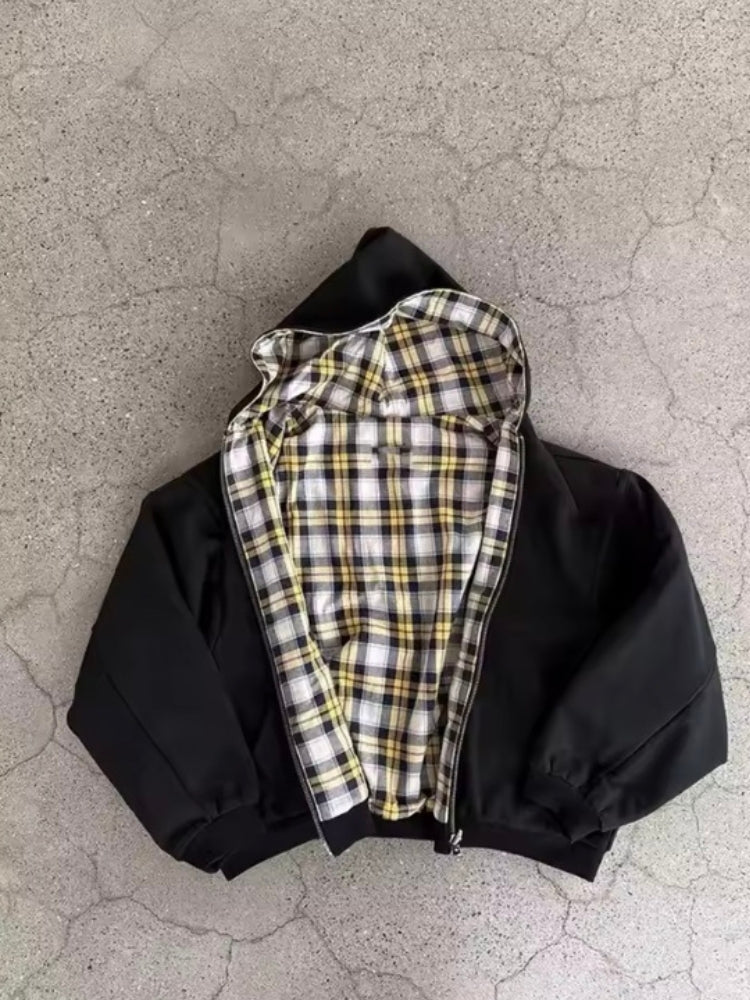 Zip fastening detail on a checkered hooded hoodie