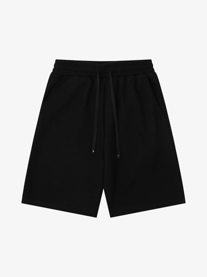 Front view of men's graphic sweat shorts with printed design and drawstring