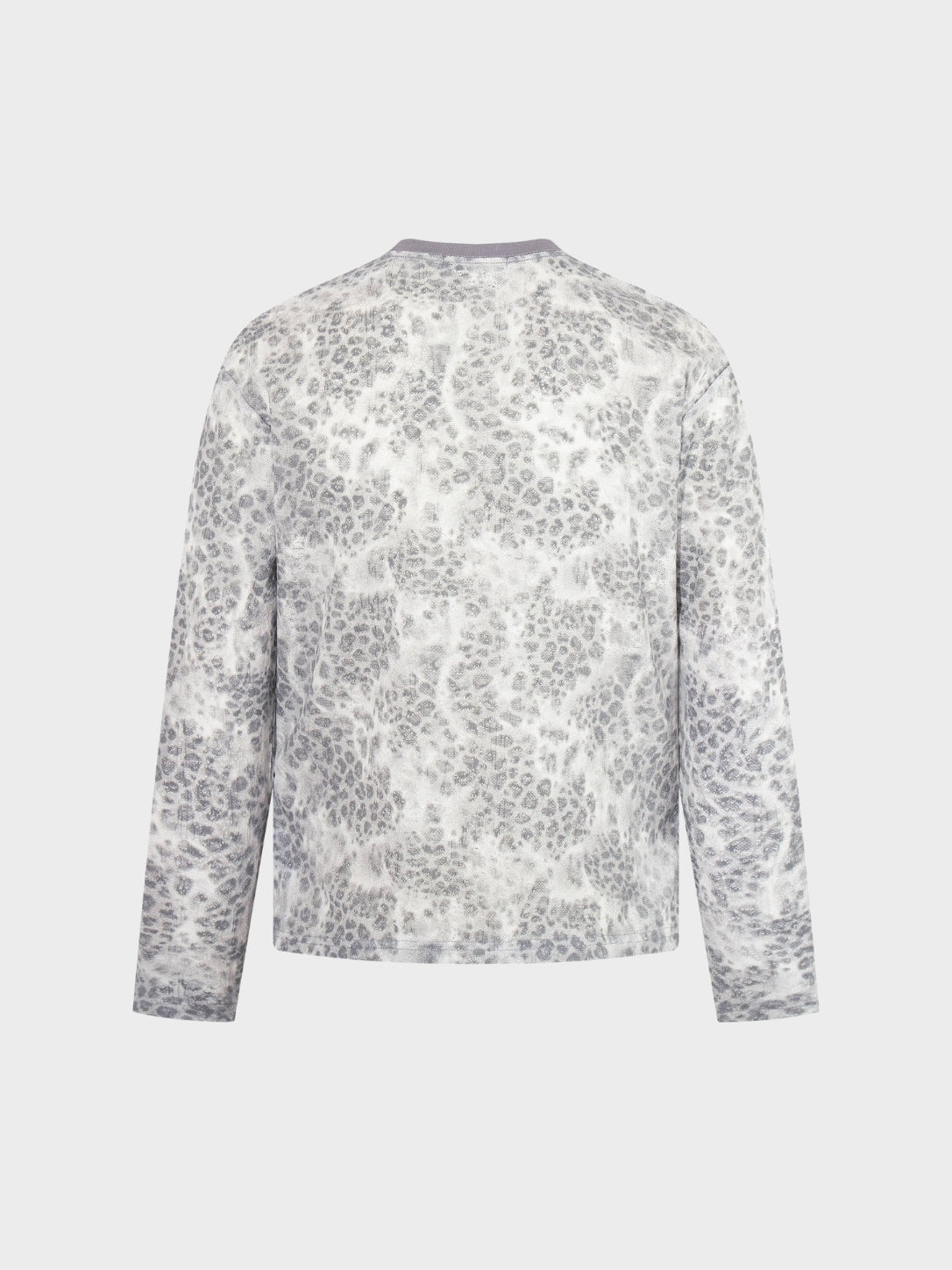 Close-up of the distressed leopard print fabric on the top
