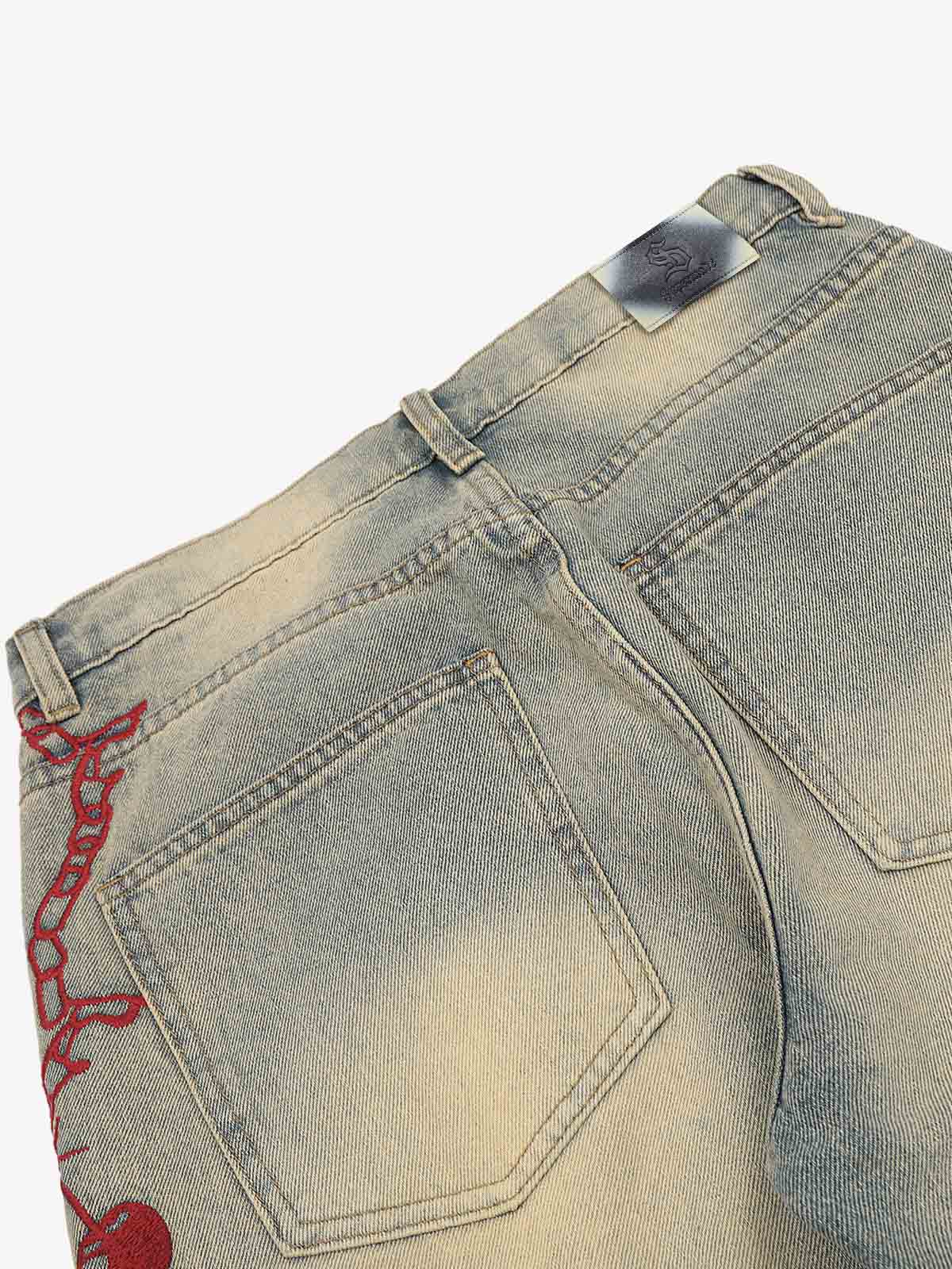 Wide-leg jeans showing distressed knees and relaxed fit