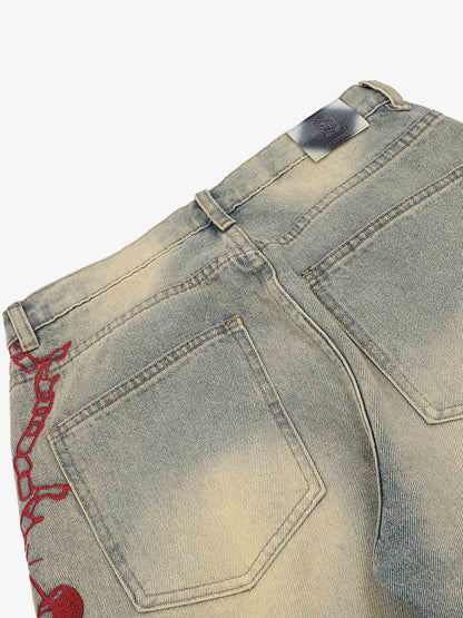 Wide-leg jeans showing distressed knees and relaxed fit