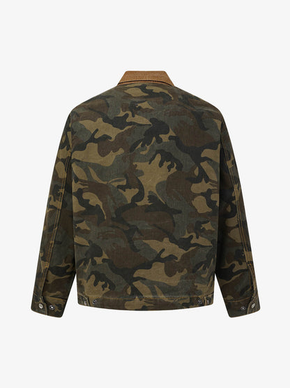 Front view of a washed camouflage denim work jacket with corduroy collar trim