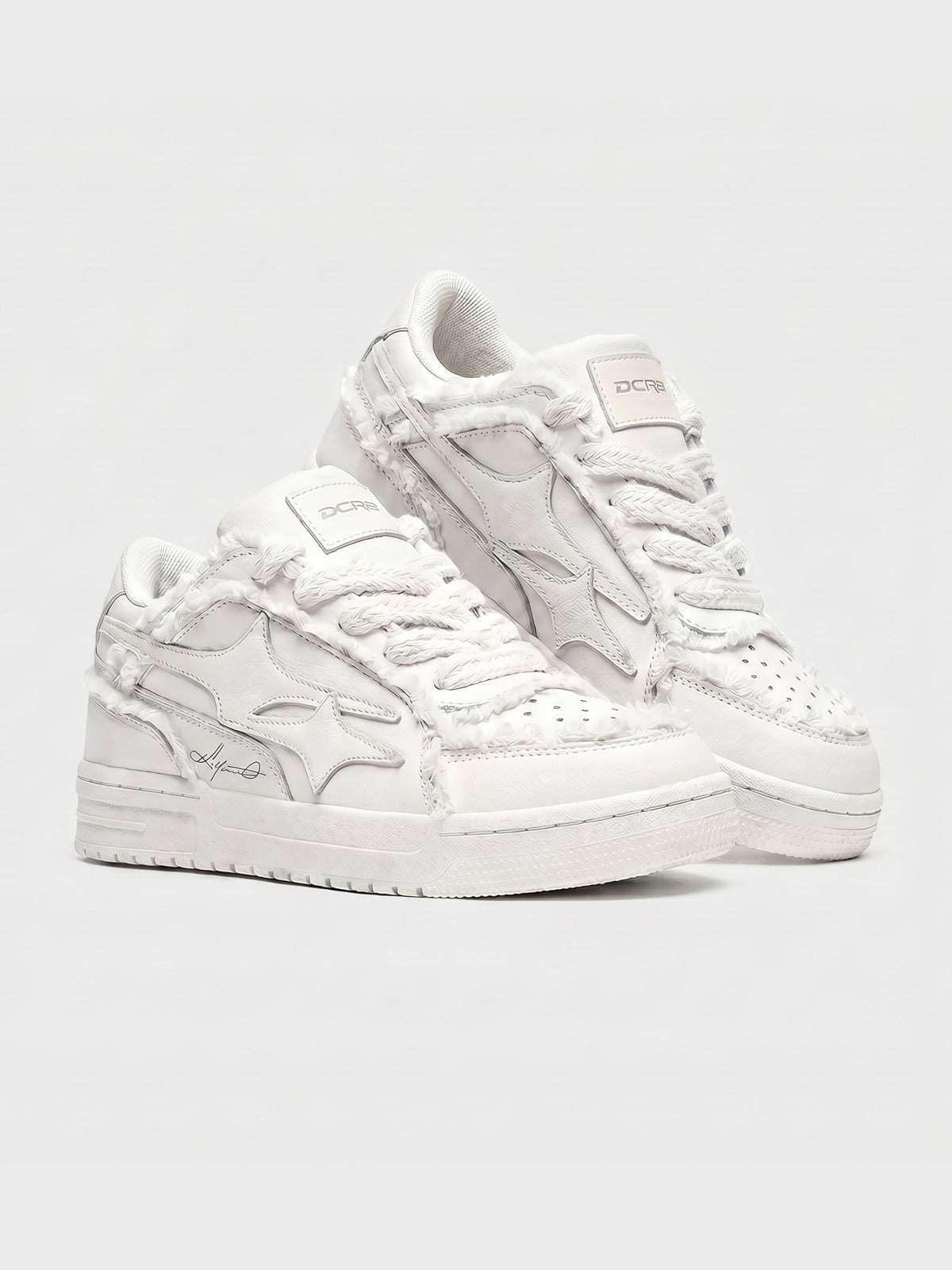 Cream sneakers shown from the back