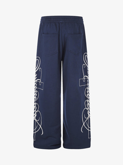 Floral graphic sweatpants displaying their wide-leg silhouette
