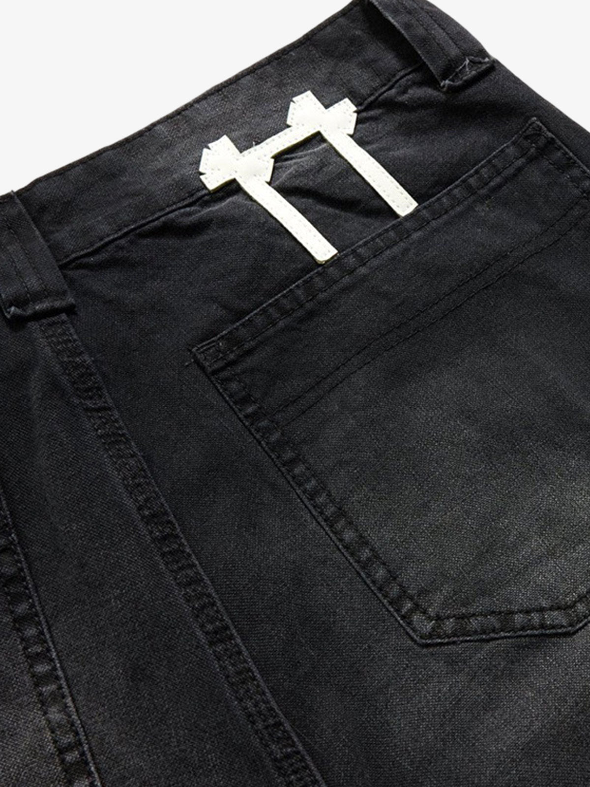 Full-length view of patchwork colour-block jeans styled for casual wear