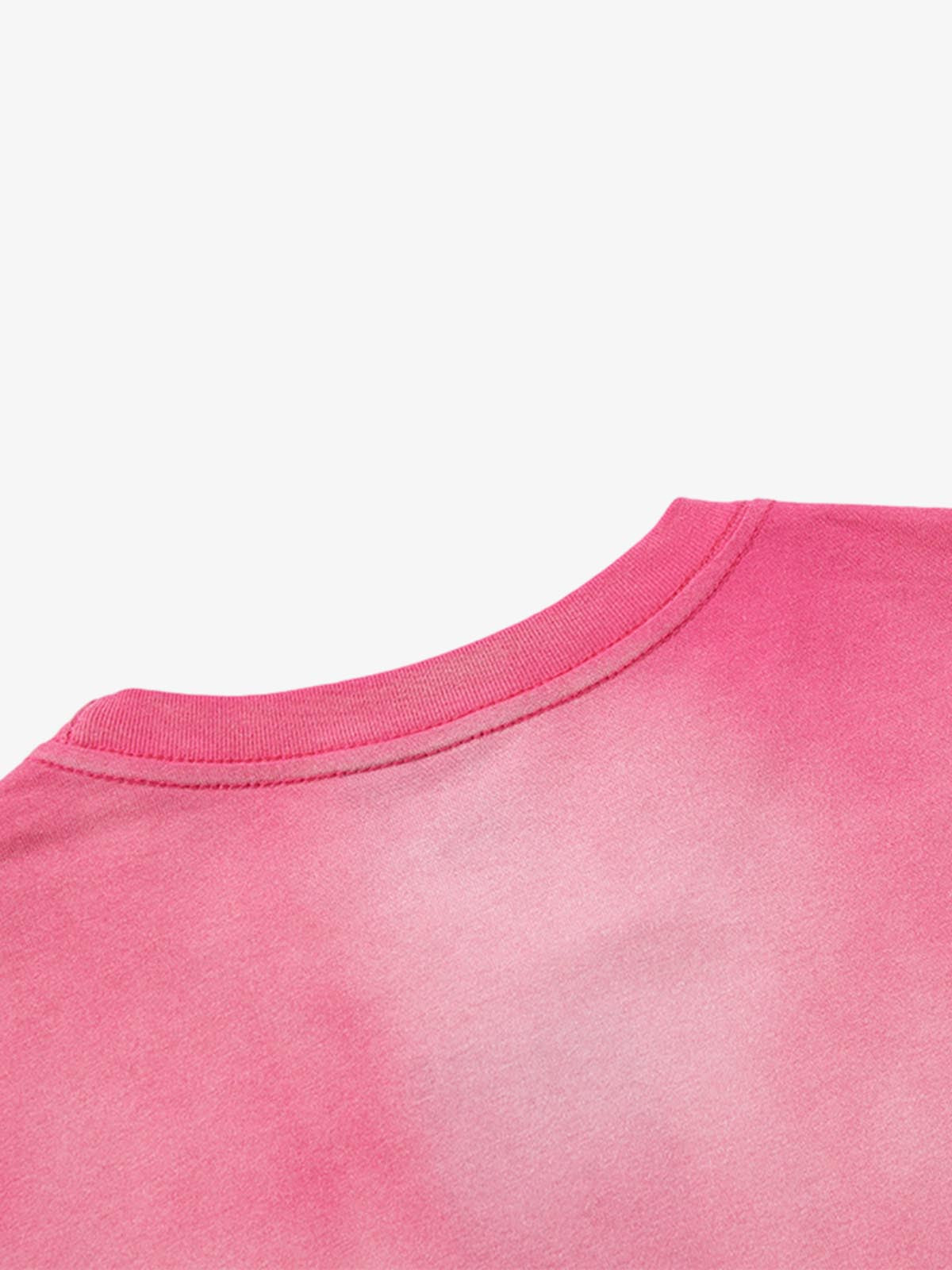 Detail view of neckline and shoulder seam on washed cotton T-shirt