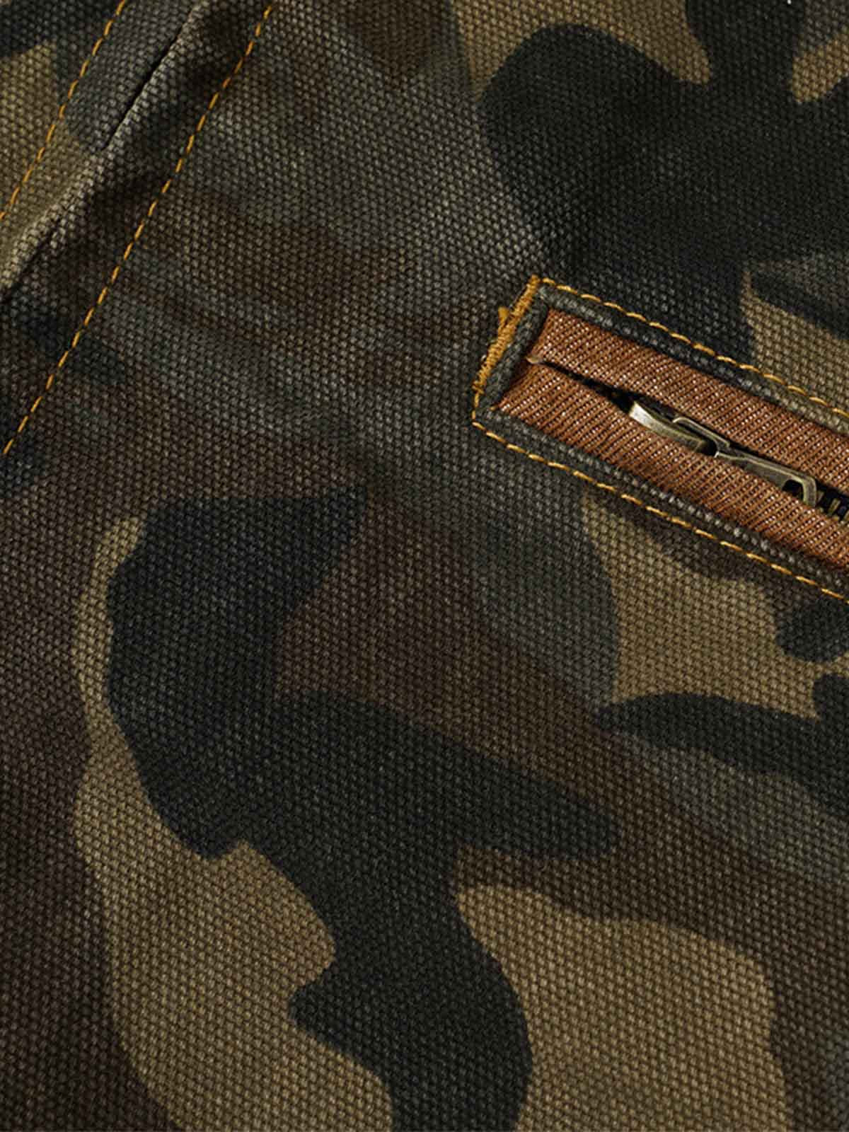 Side view of a washed camouflage denim work jacket with practical pockets