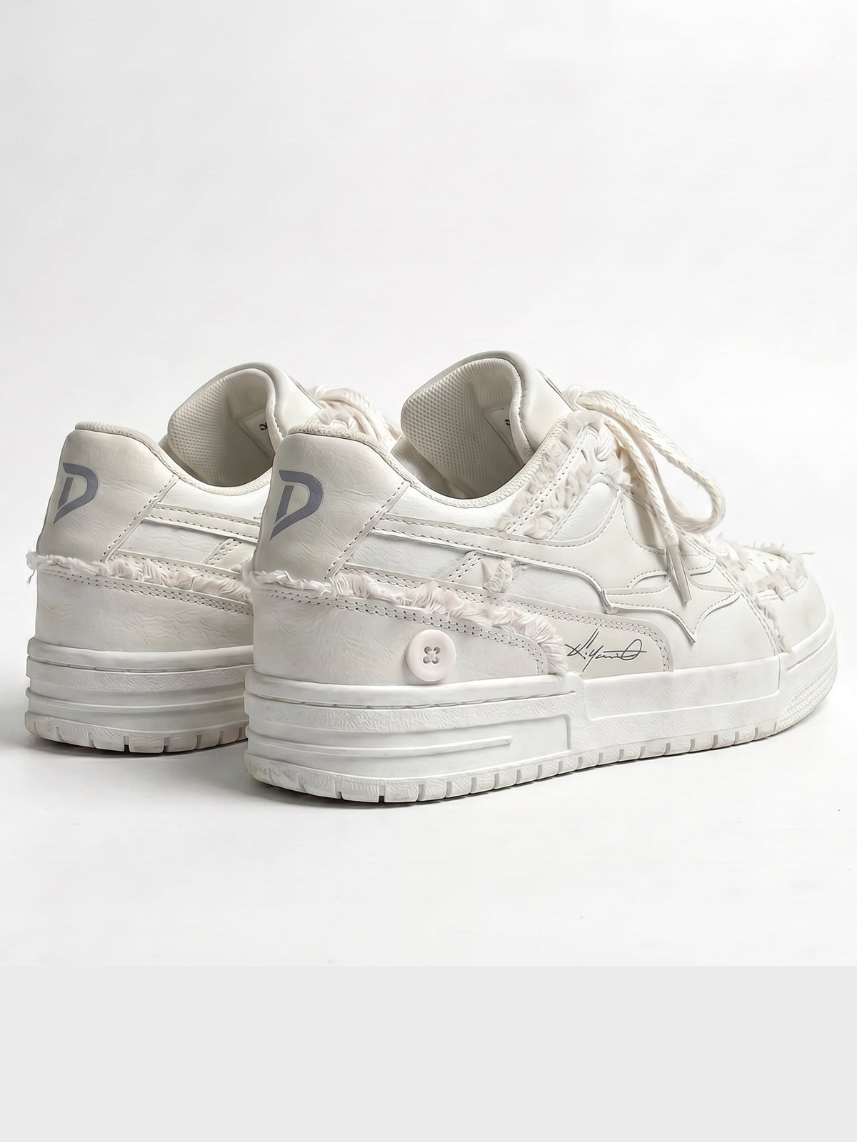 Cream trainers displayed as a matching pair