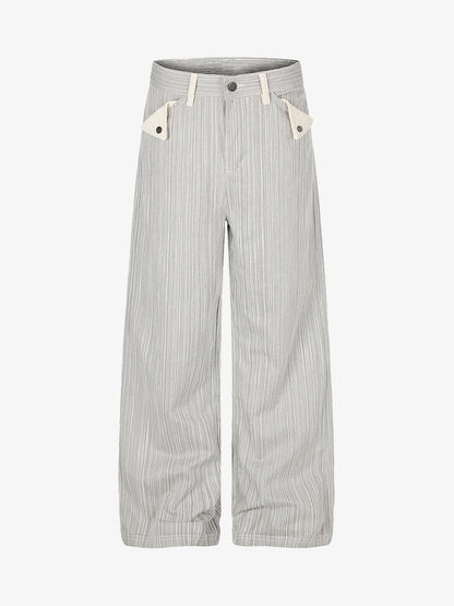 Wide-leg jeans with a bold graphic print and chain pocket details