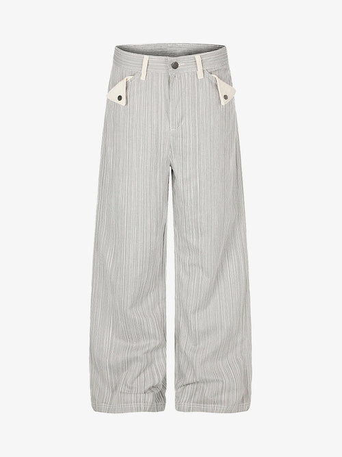 Wide-leg jeans with a bold graphic print and chain pocket details