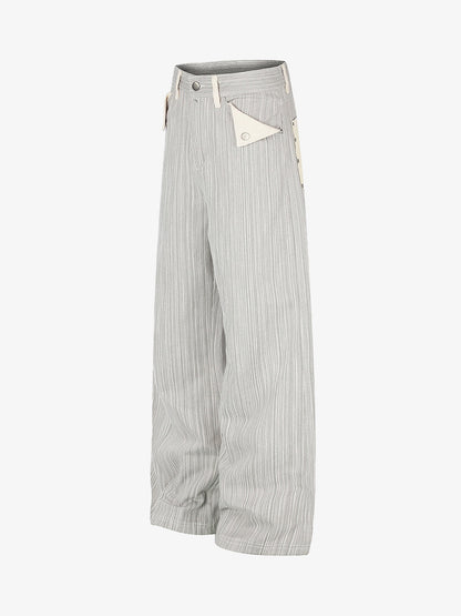Close-up of the chain pocket detail on graphic print jeans