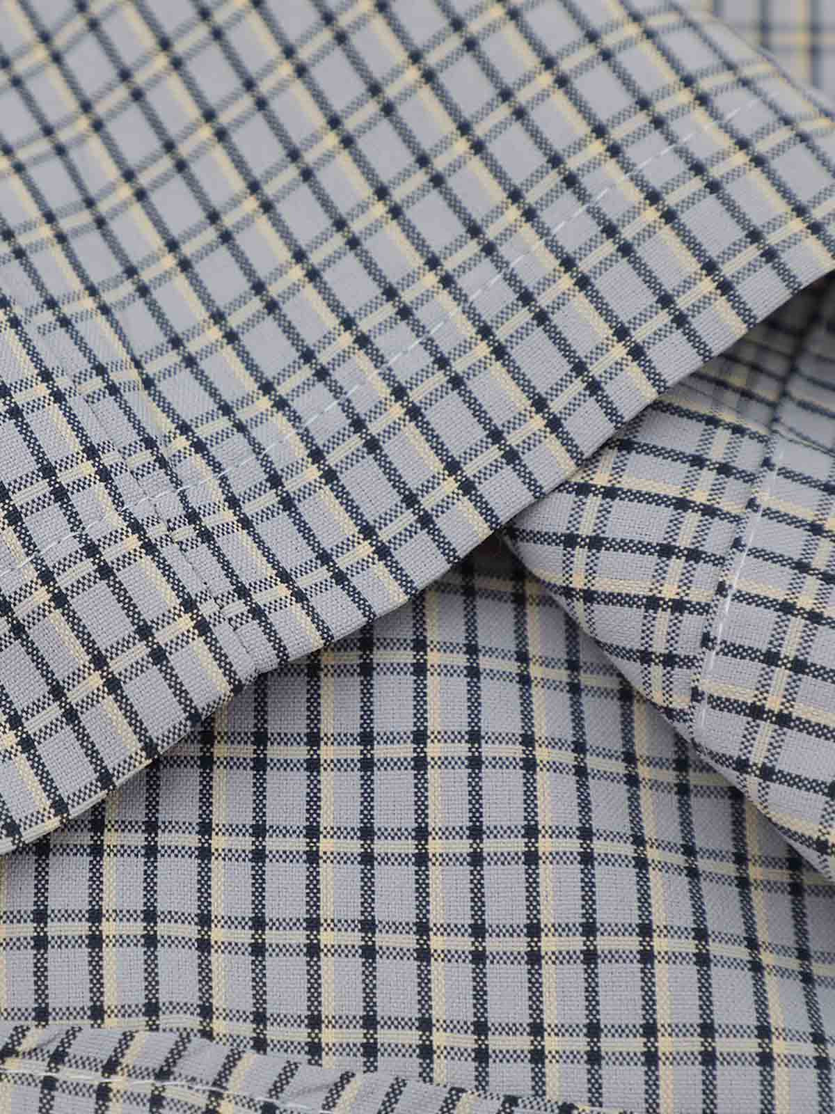 Fabric close-up of plaid cotton blend shirt with embroidered detail
