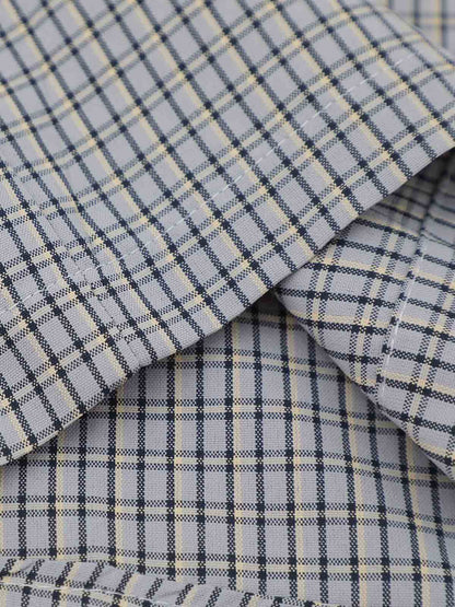 Fabric close-up of plaid cotton blend shirt with embroidered detail
