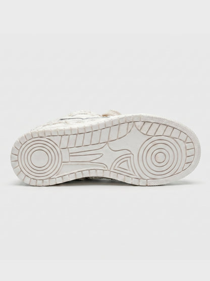 Close-up of the cream sneaker upper and laces