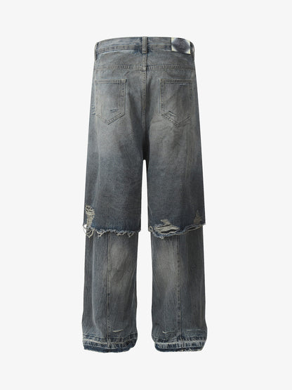 Side view showing the wide-leg cut of the ripped jeans