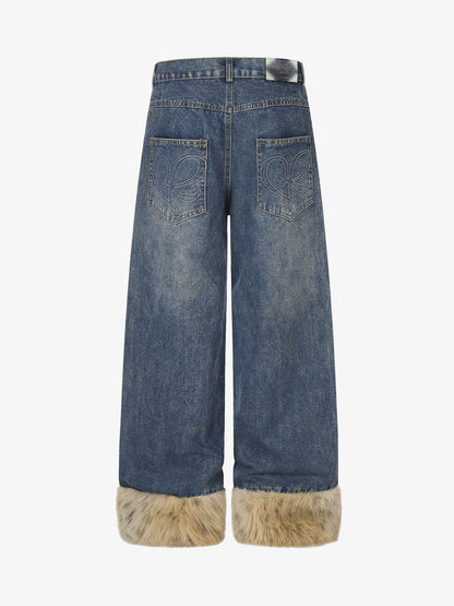 Wide-leg jeans featuring studded detailing along the legs