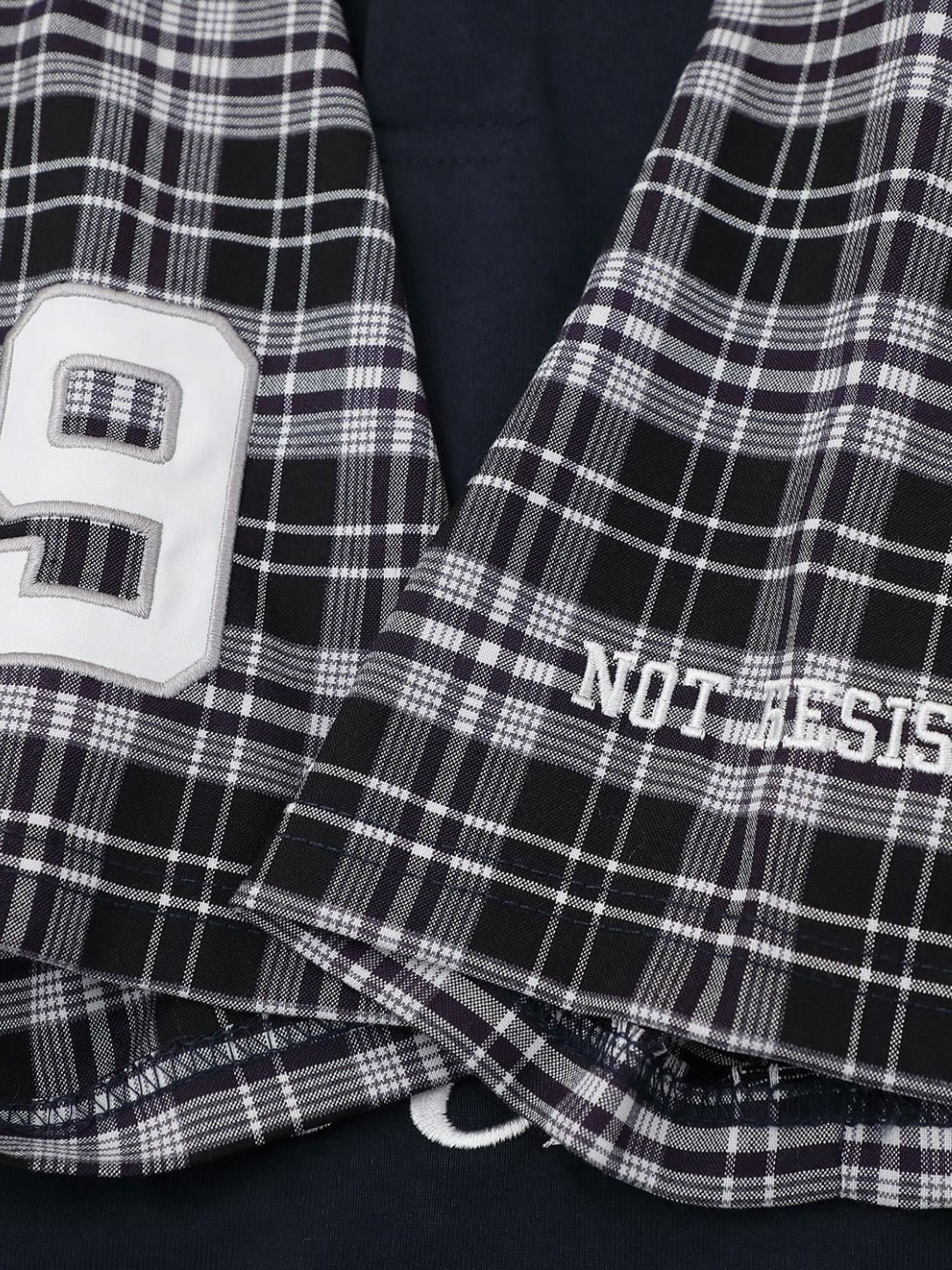 Cotton fabric texture on the plaid sleeve polo shirt