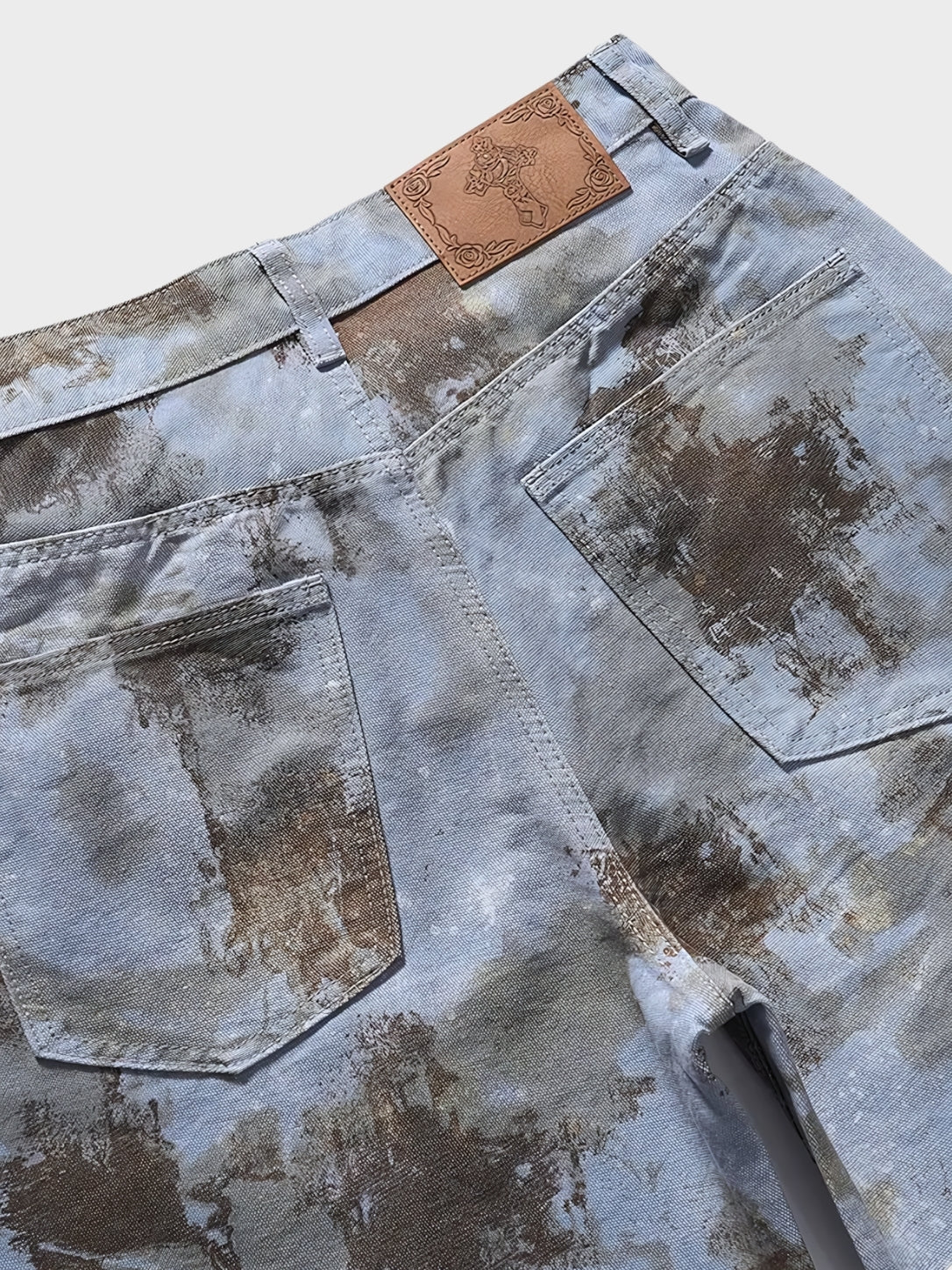 Close-up of black denim fabric and pocket detail on men's jorts