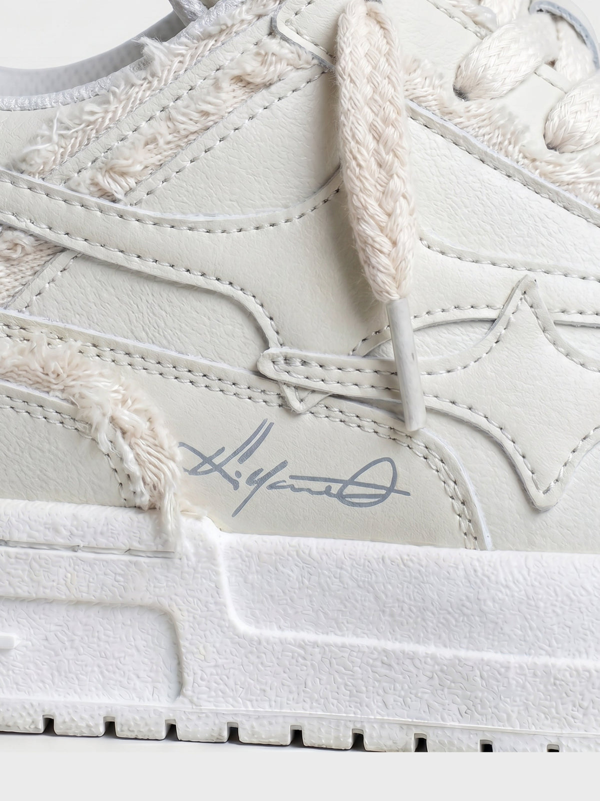 Top view of cream lace-up everyday sneakers