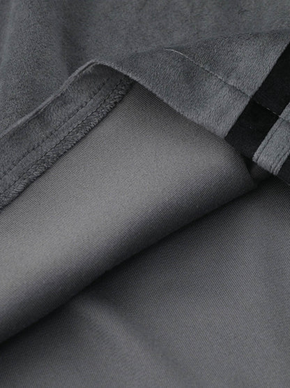 Full-length view of model in suede athletic shorts