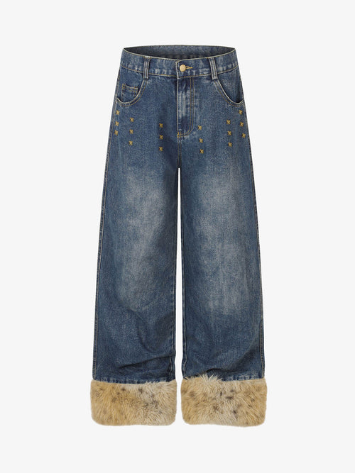Studded wide-leg jeans with faux fur cuffs shown from the front