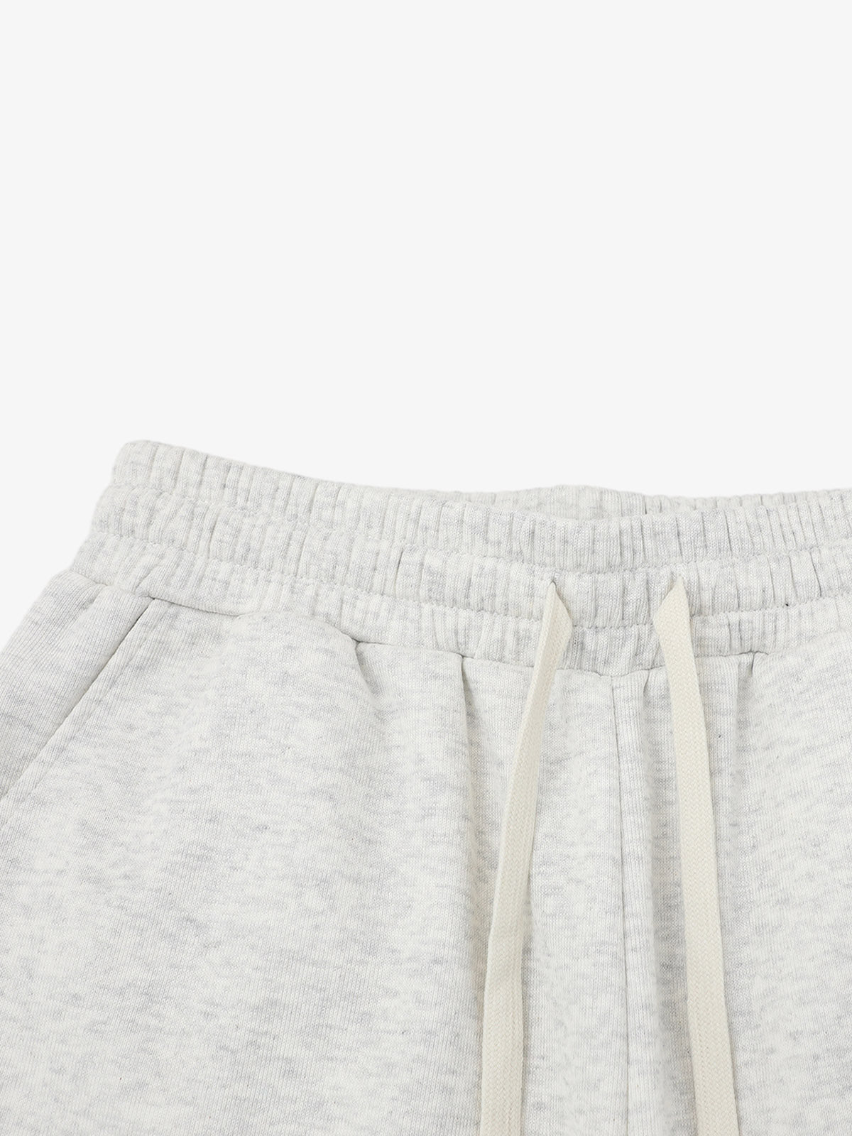 Close-up of drawstring waist on men's graphic sweat shorts