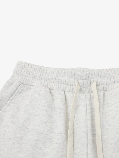 Close-up of drawstring waist on men's graphic sweat shorts