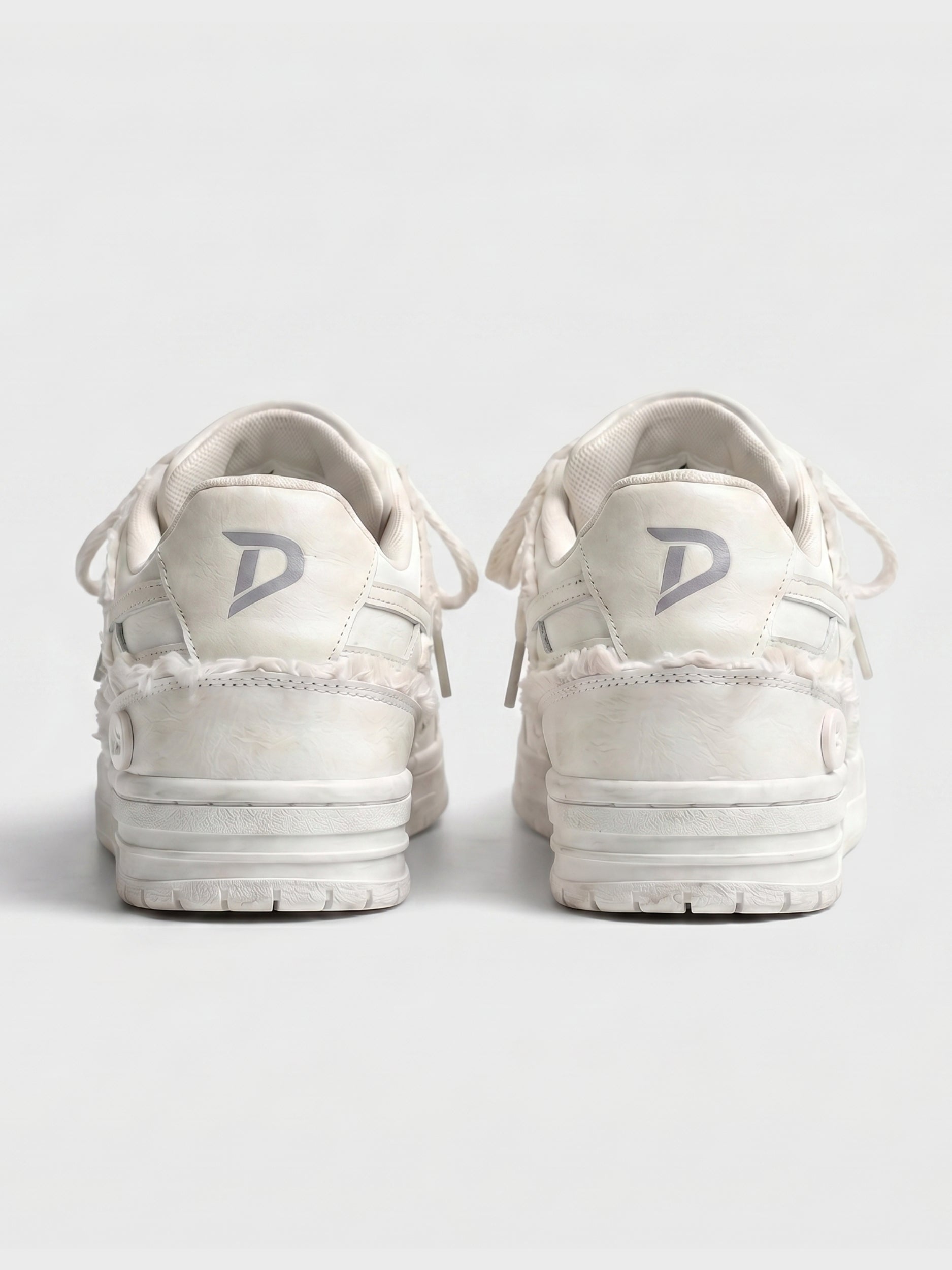 Cream lace-up sneakers shown on a clean background
